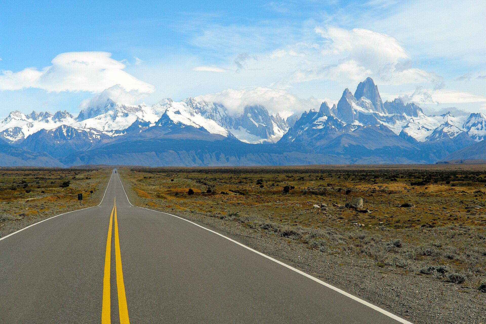 A paved Patagonian road leading toward the Fitz Roy mountains near El Chaltén