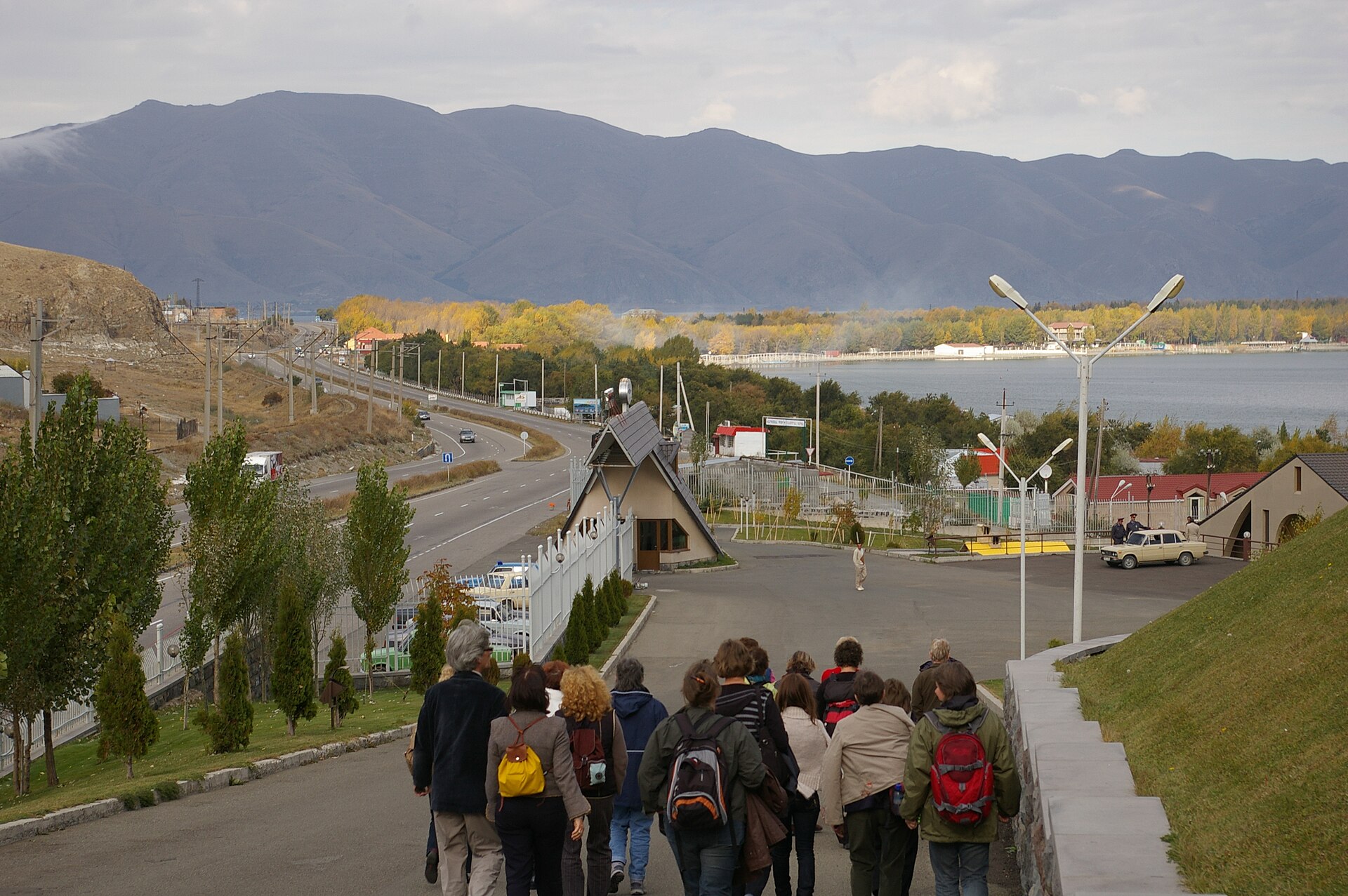 Main highway beside Lake Sevan with mountains and a divided road