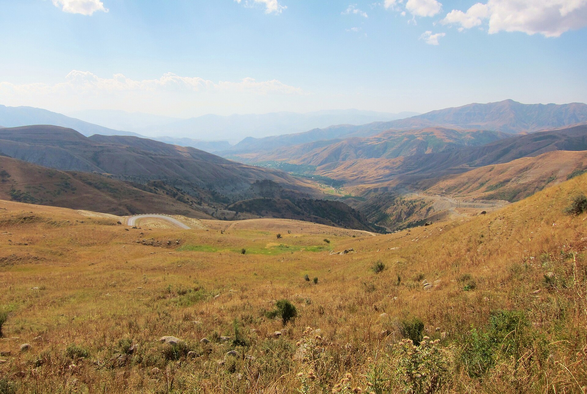 Winding road through the high Vardenyats Pass landscape in Armenia
