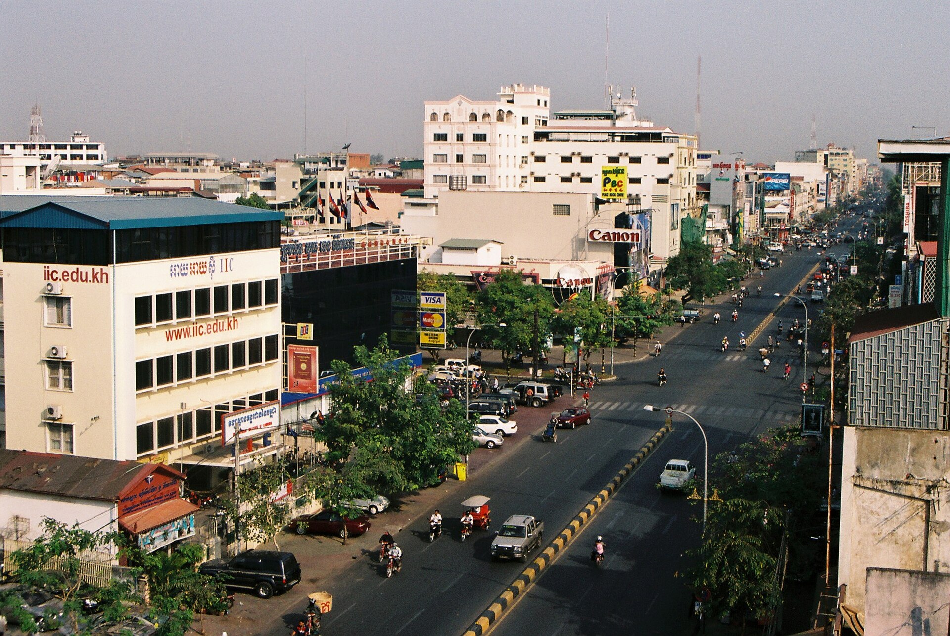 Divided city road with cars and motorcycles in Phnom Penh, Cambodia