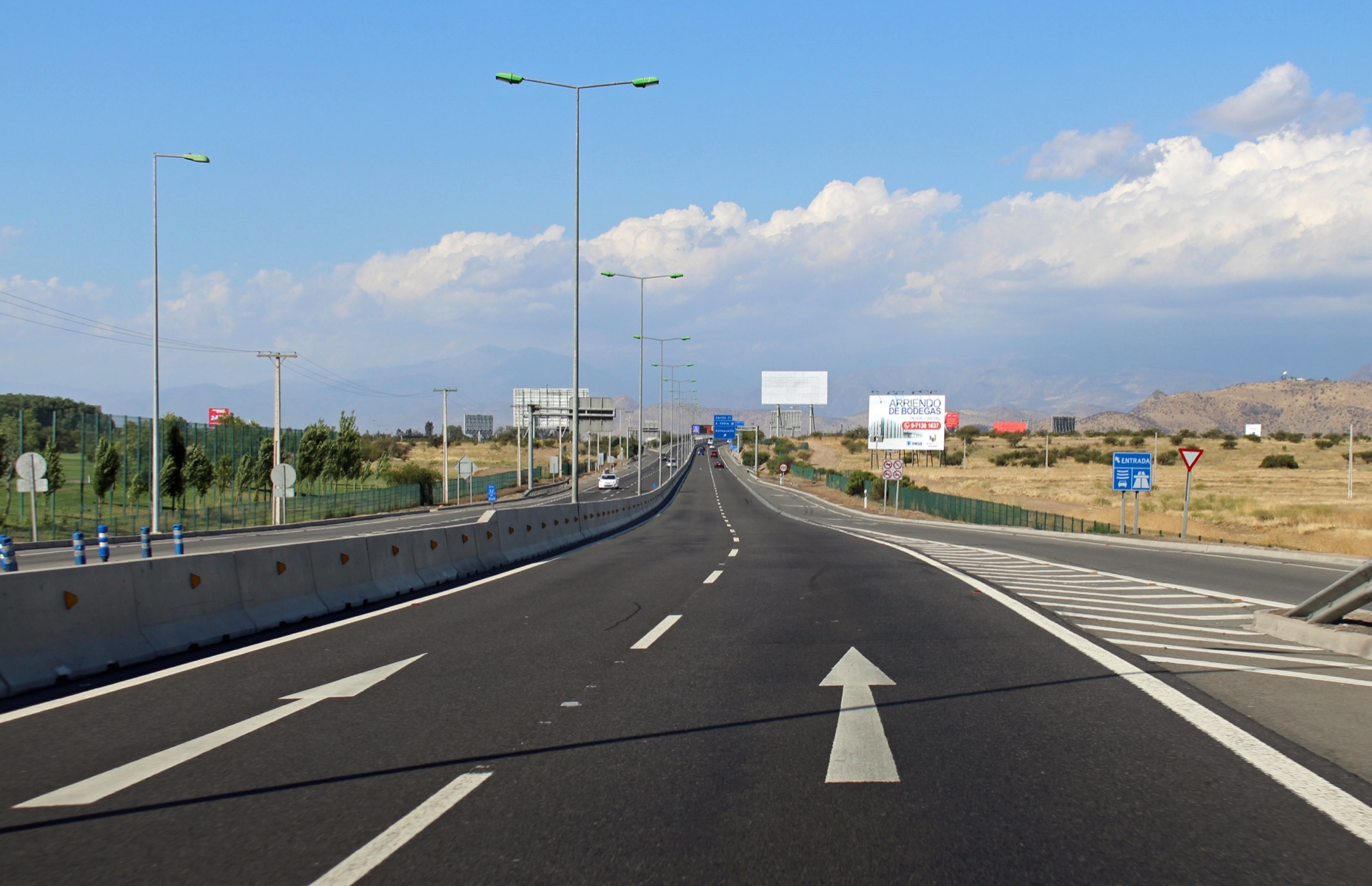 Costanera Norte motorway in Santiago with mountains behind the lanes
