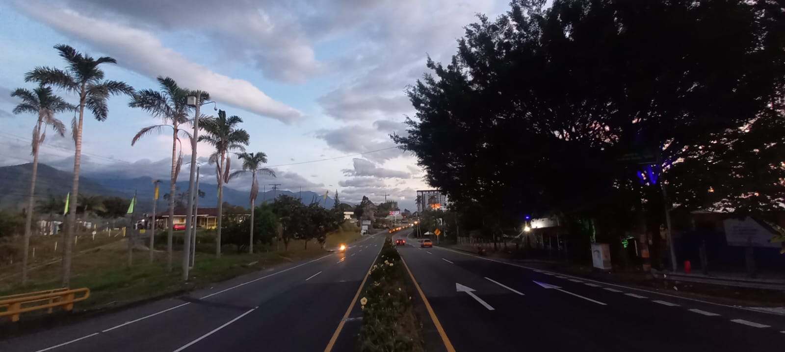 Divided Coffee Highway near Armenia in Colombia with mountains beyond the road