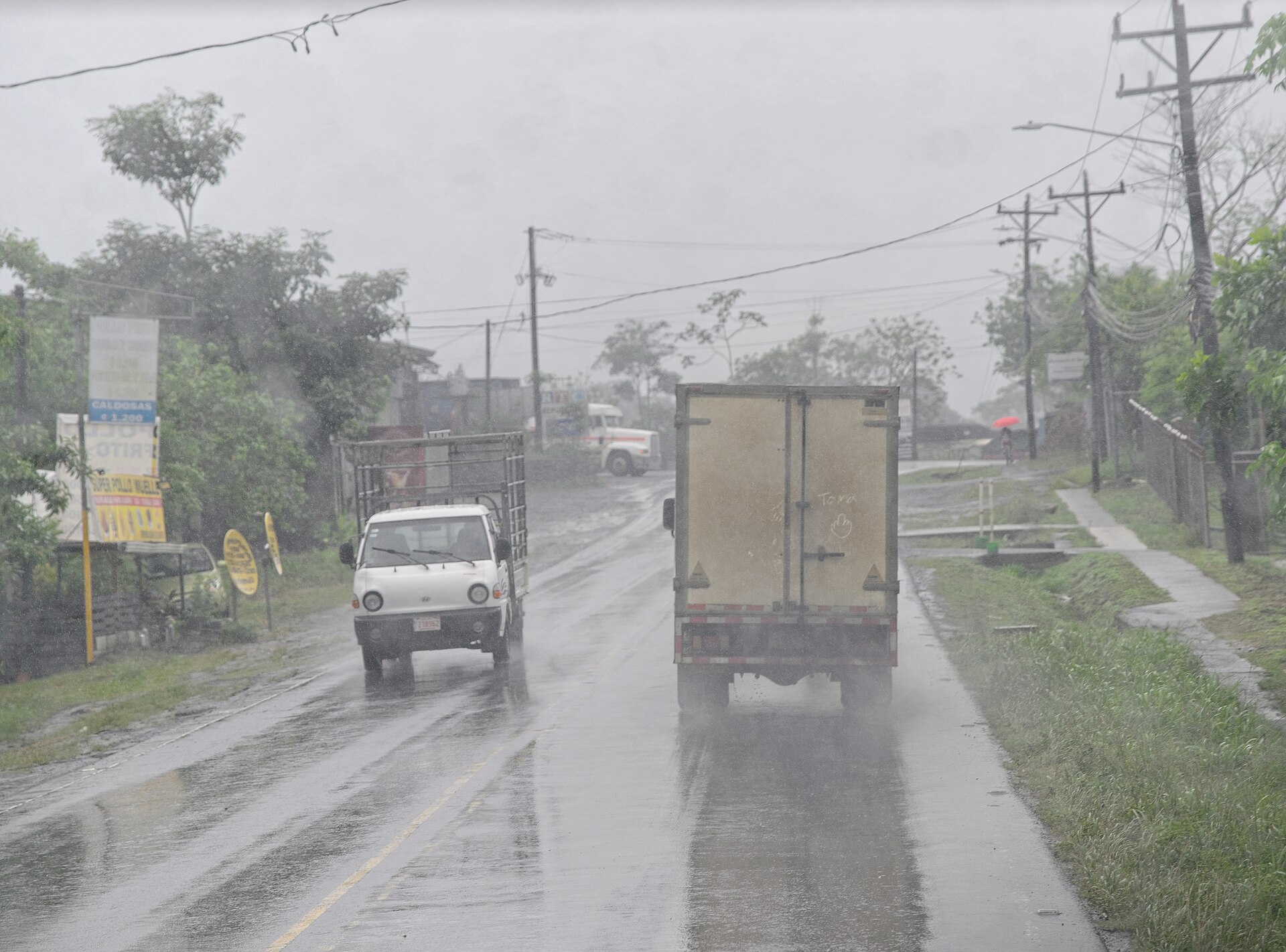Traffic on a rain-soaked road in the Arenal region of Costa Rica