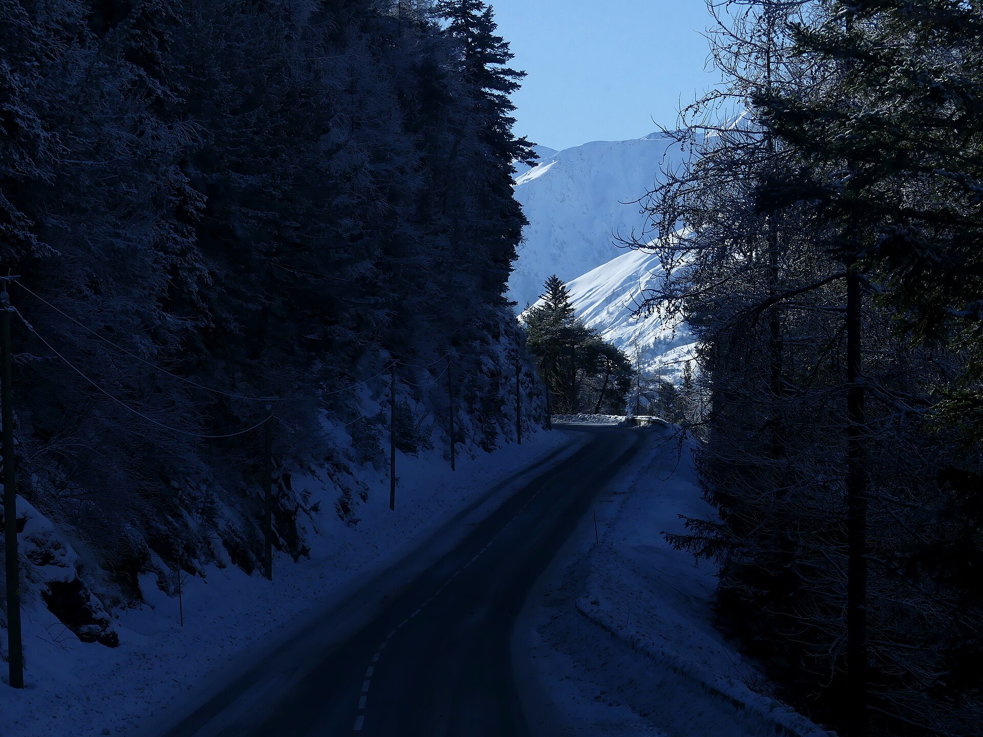 Snow-covered Route départementale 902 below the Col du Télégraphe in Savoie