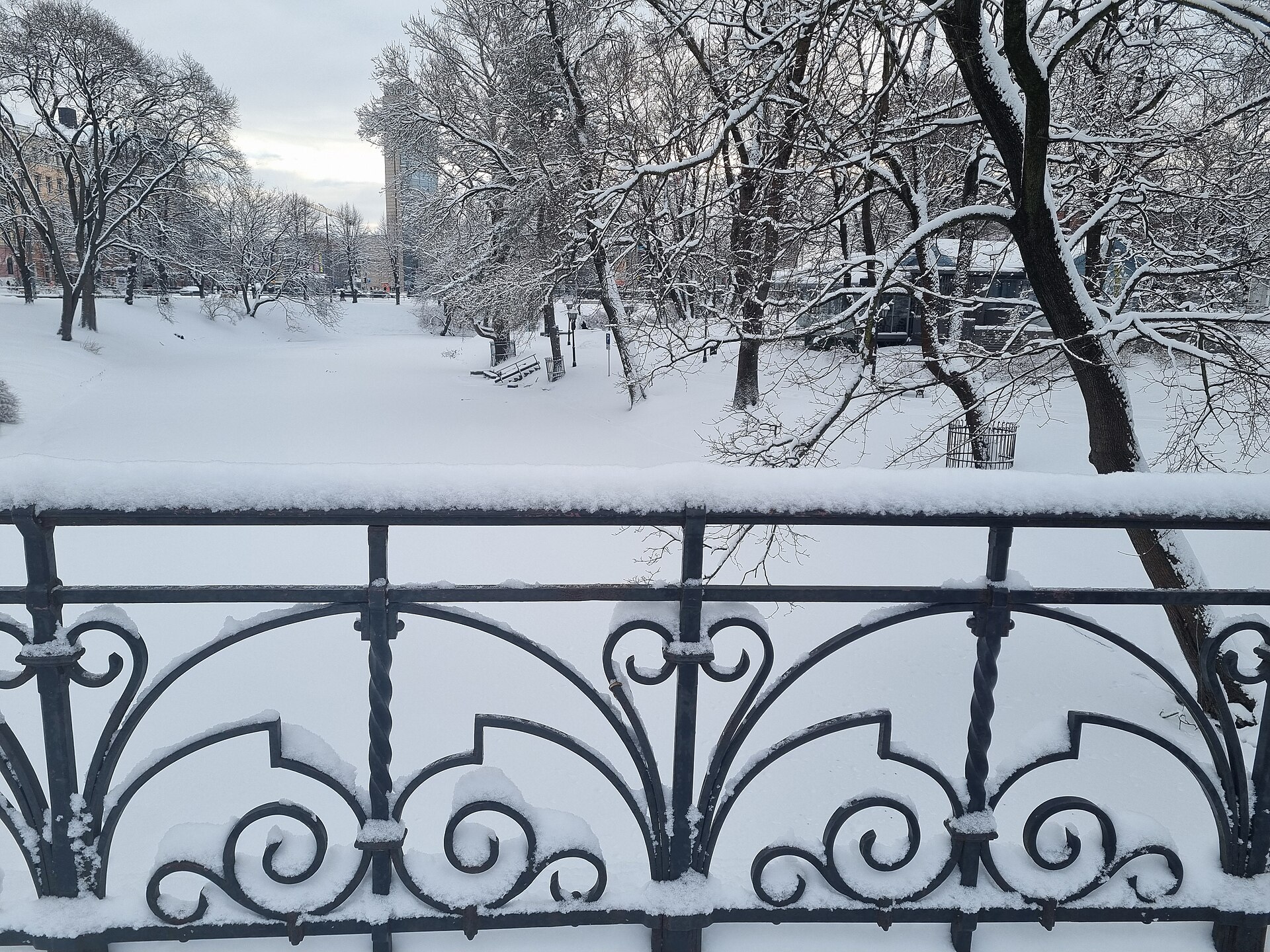 Snow-covered park and railings in Riga, Latvia