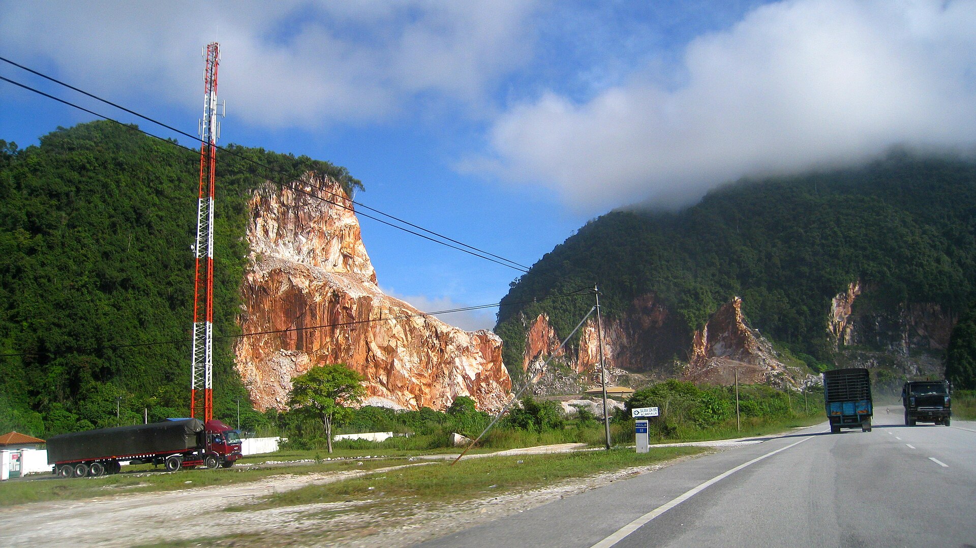 Two-lane mountain road with lorries on the way to Malaysia's Cameron Highlands