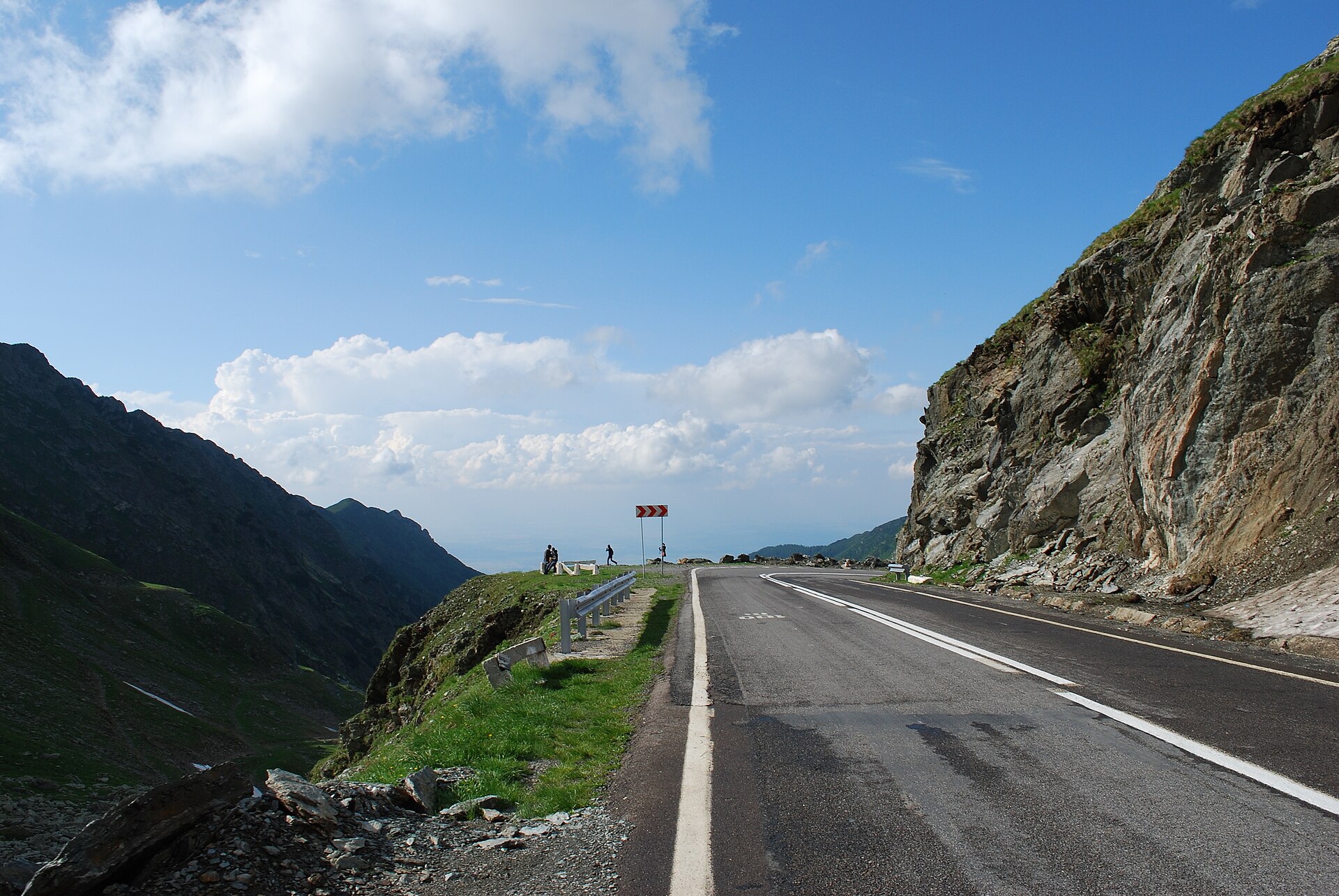 Transfăgărășan mountain road curving beside a steep rocky slope