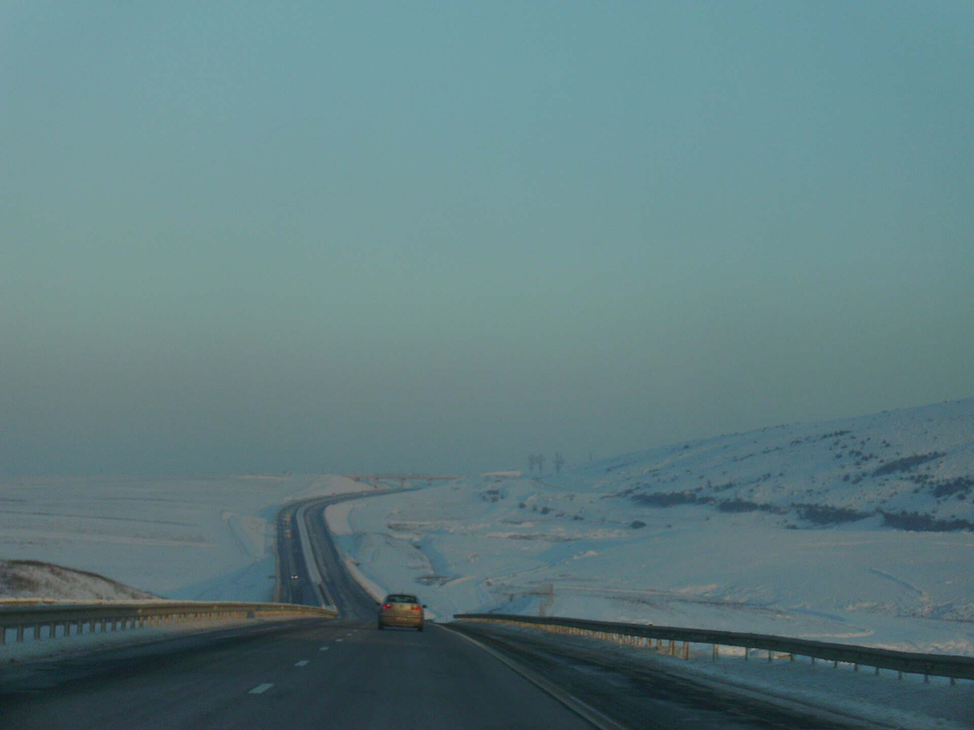 A motorway crossing snowy Transylvanian hills