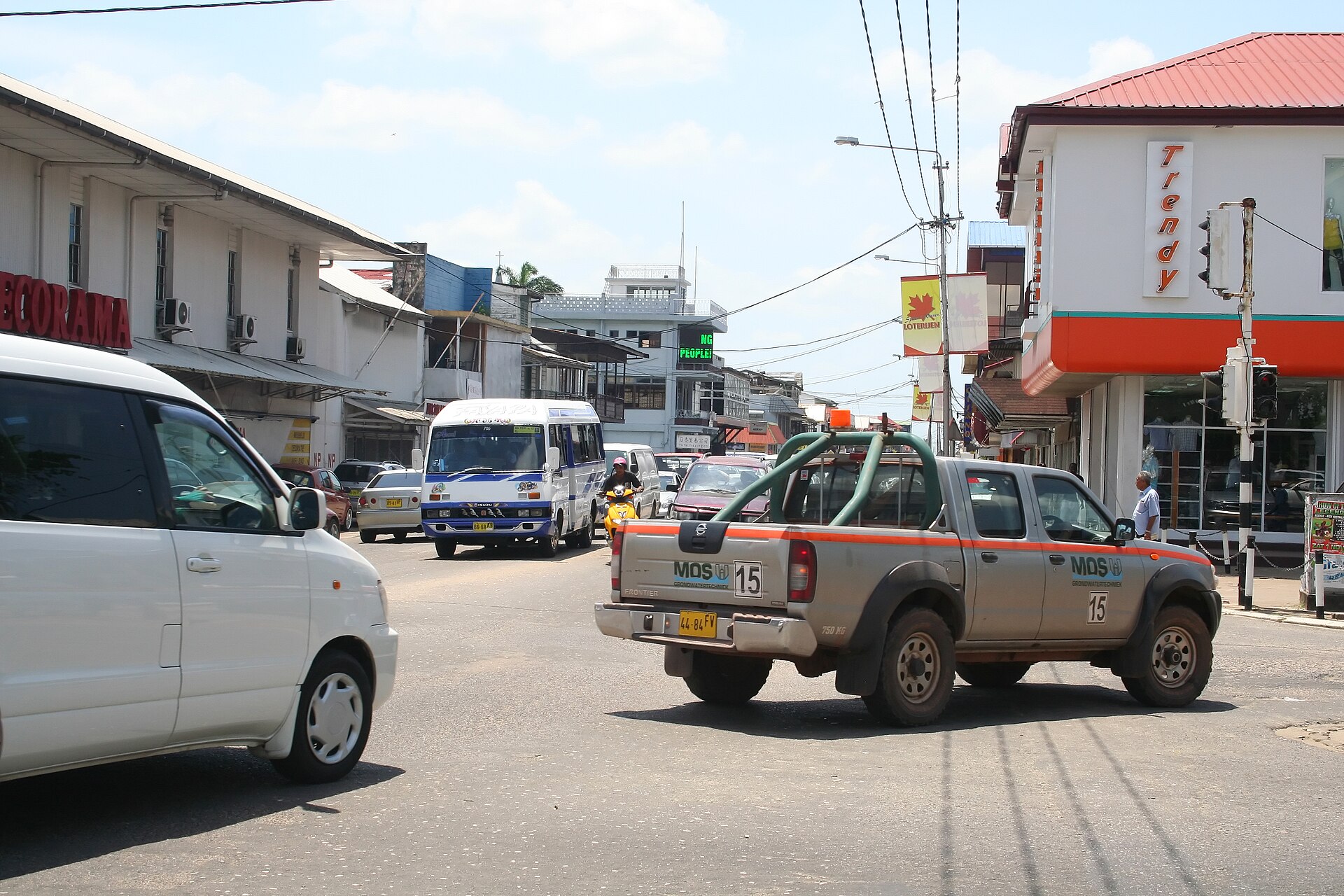 Paramaribo street in Suriname with low-rise buildings and local traffic