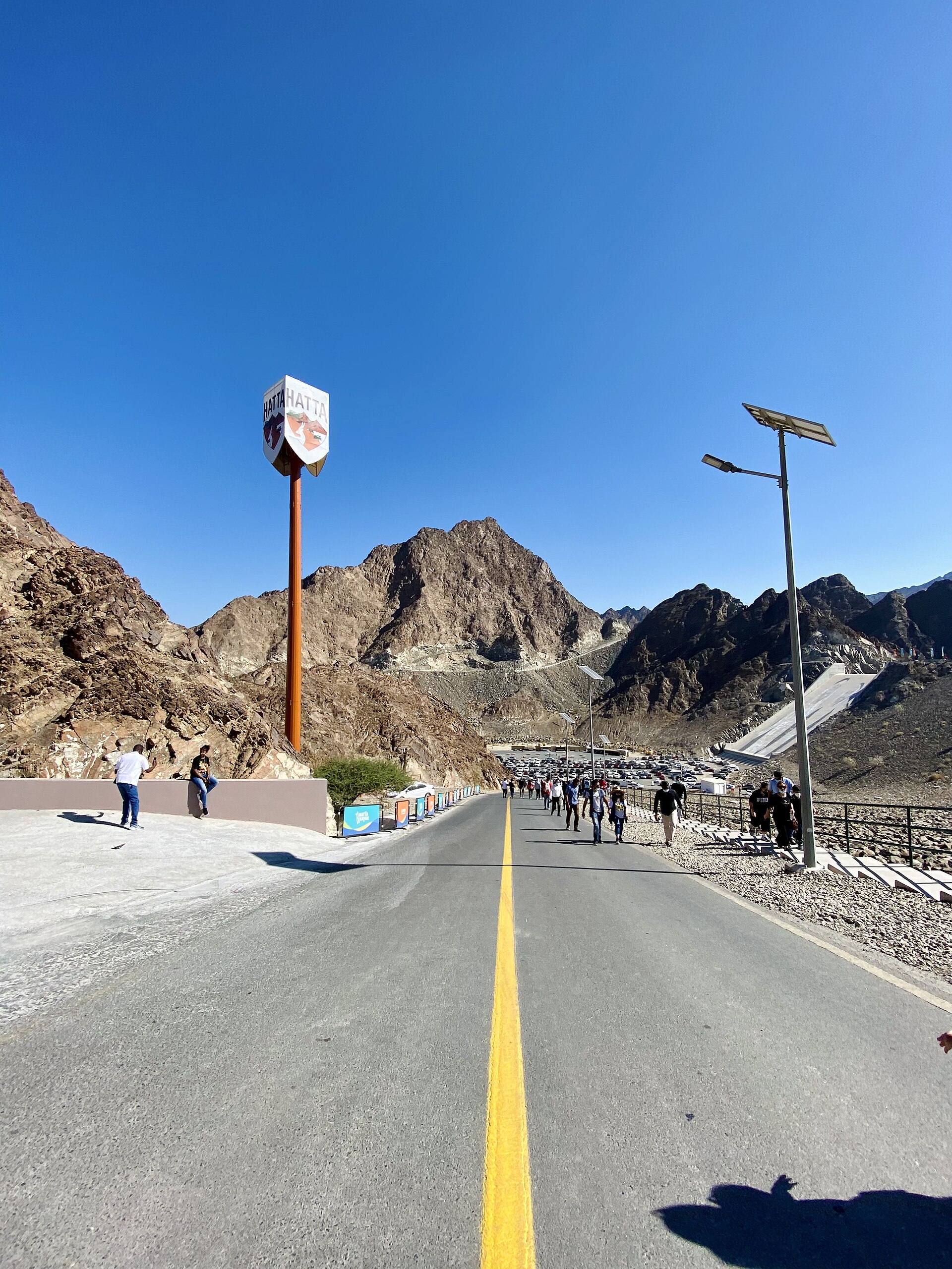 Paved road and rugged Hajar Mountains at Hatta in the UAE