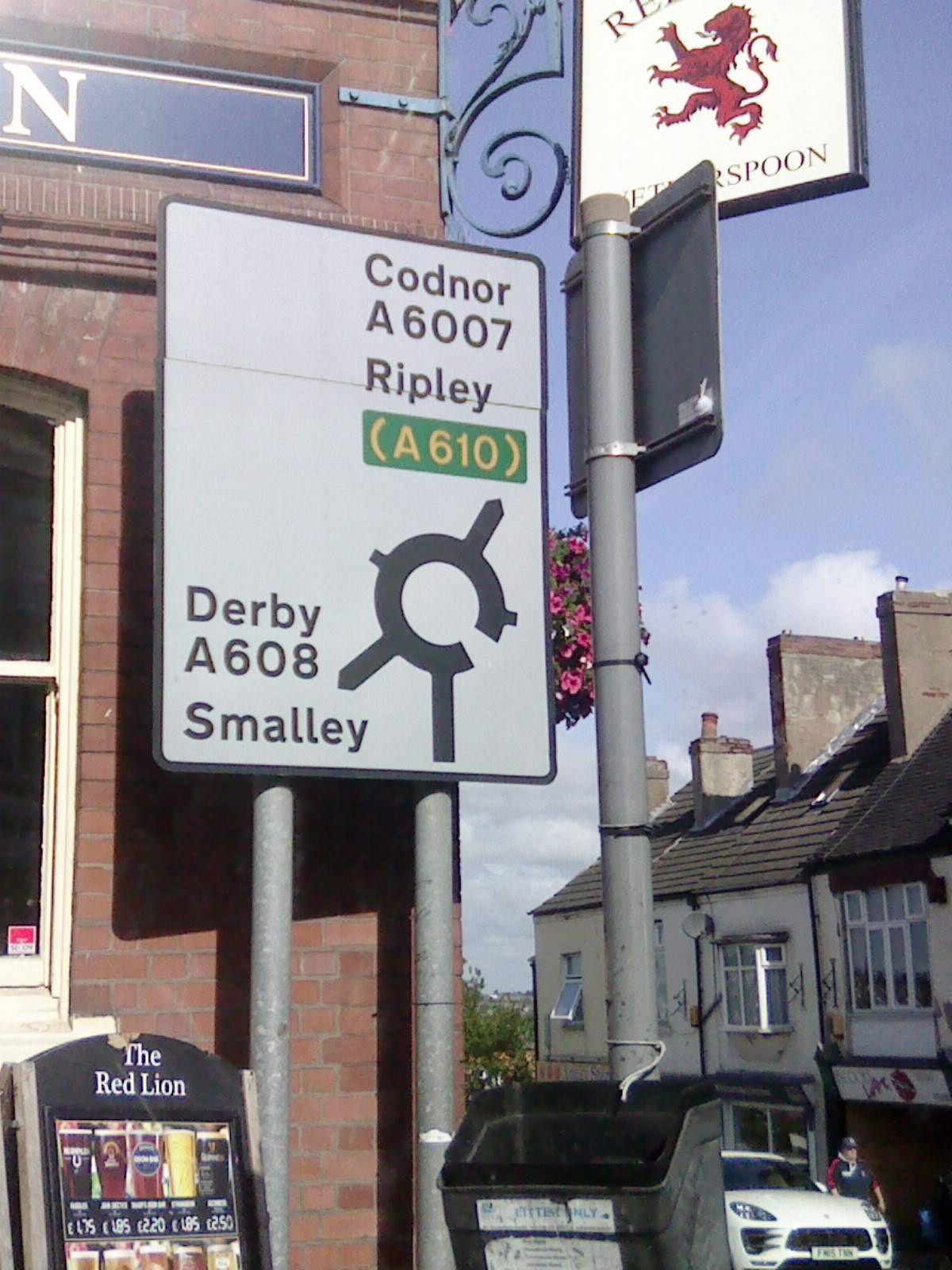 UK roundabout direction sign in an urban street