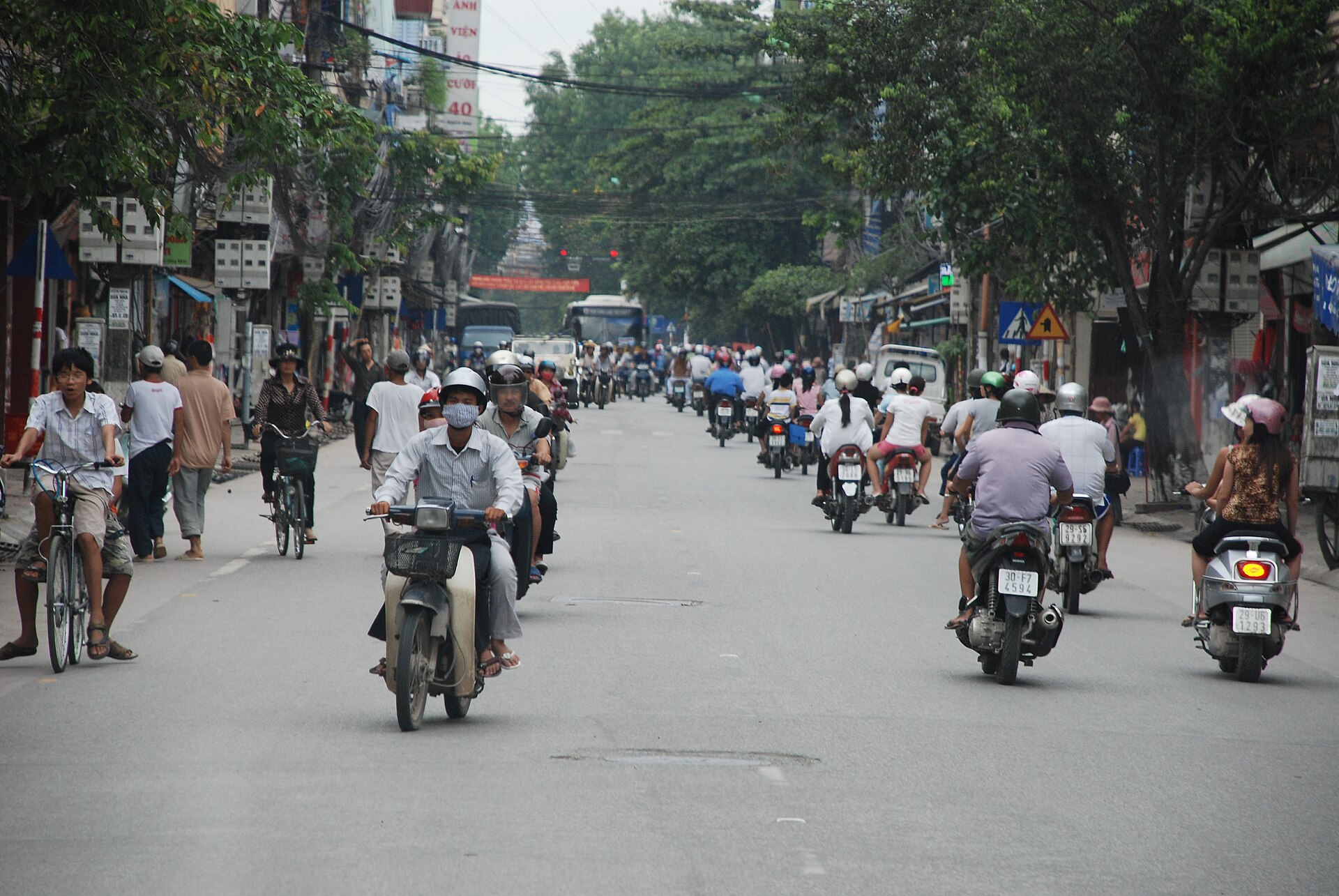 Dense motorbike and car traffic on a Hanoi street